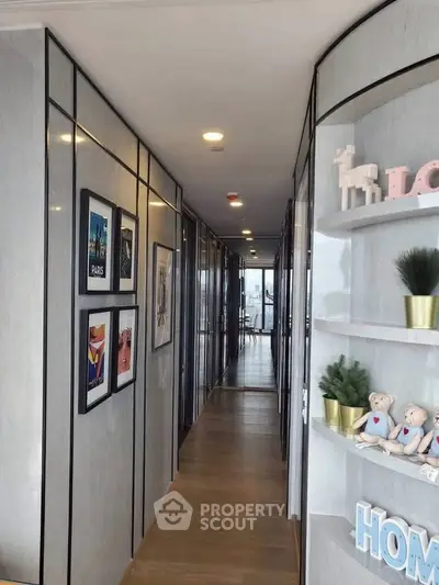 Modern hallway with stylish decor and wooden flooring in a contemporary apartment.