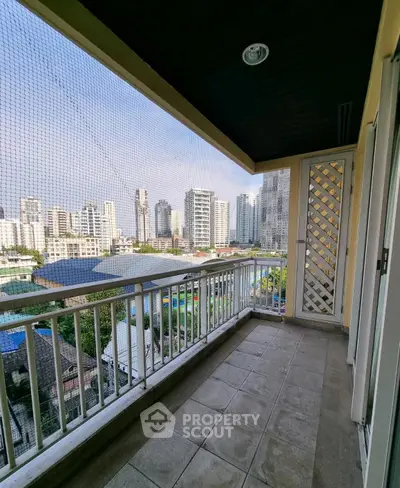 Spacious balcony with city skyline view in modern apartment