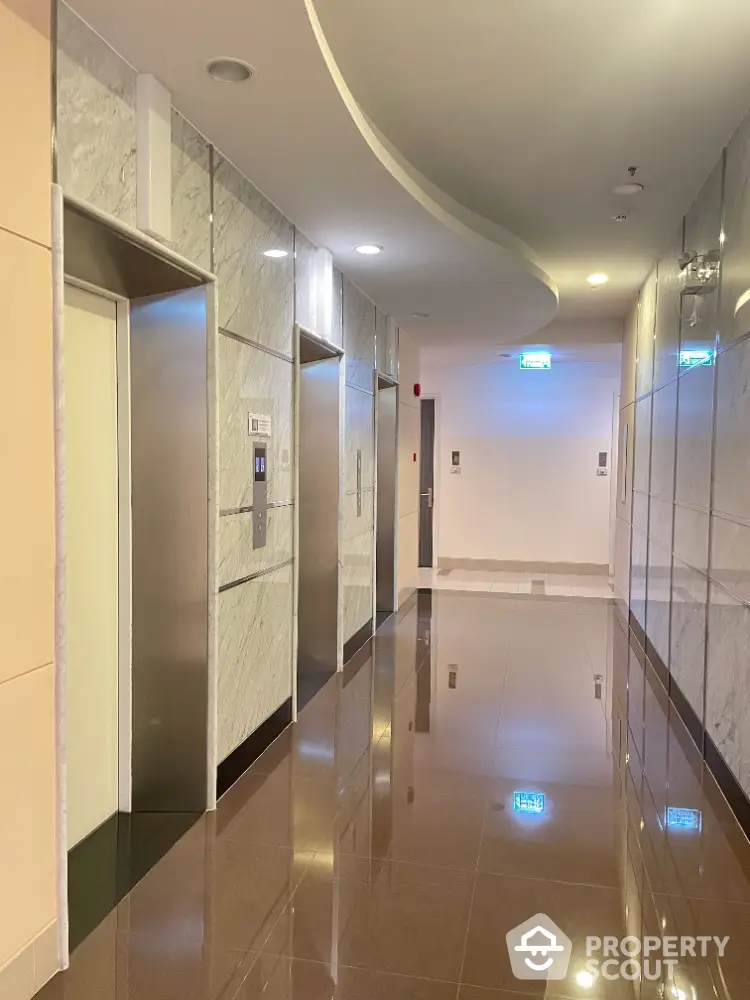 Modern building elevator lobby with sleek marble walls and polished floors