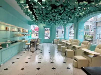 Chic modern interior with unique ceiling design and stylish seating in vibrant commercial space.