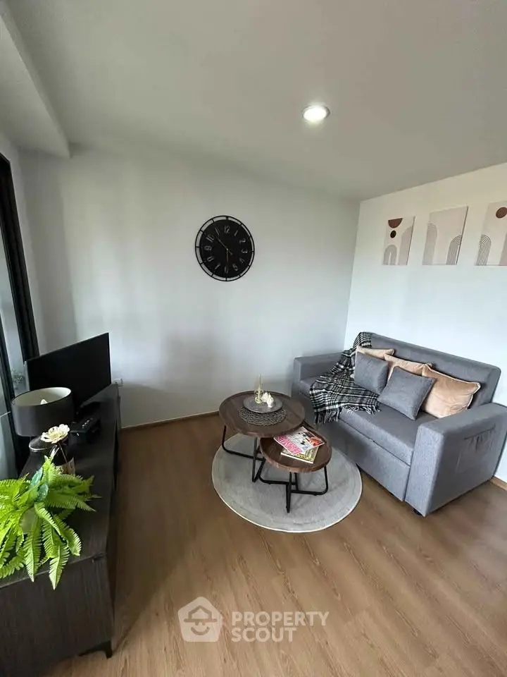 Cozy modern living room with stylish decor and comfortable seating.