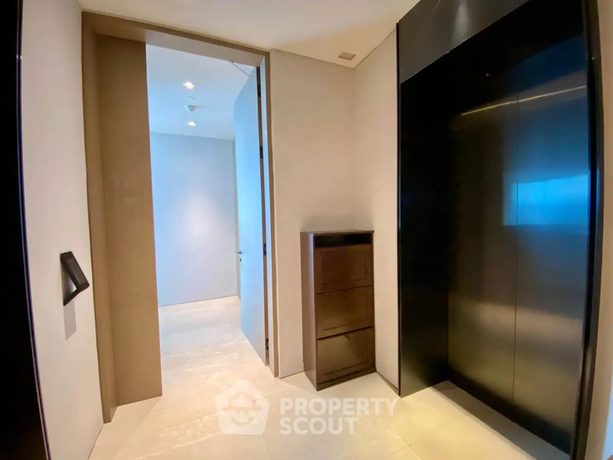 Modern elevator lobby with sleek design and ambient lighting