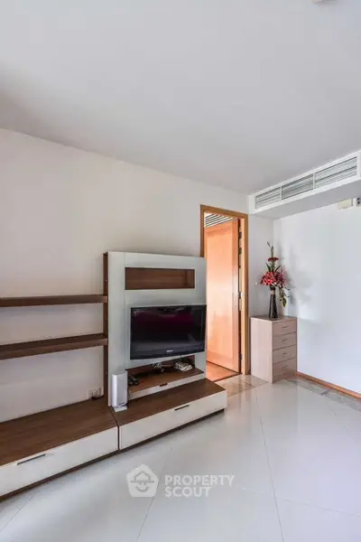 Modern living room with sleek TV stand and minimalist decor