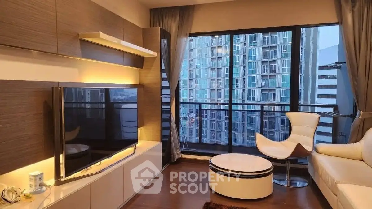 Modern living room with large window and city view, stylish furniture and warm lighting.