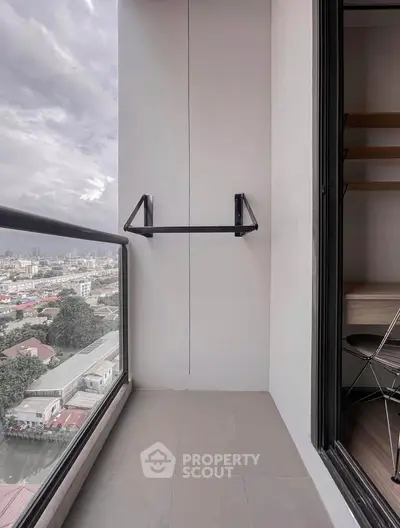 Modern balcony with city view and sleek railing, perfect for urban living.