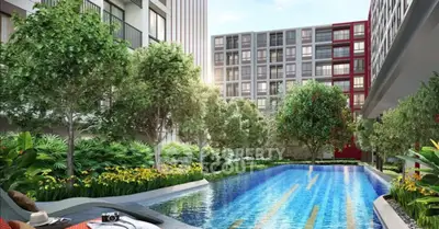 Luxurious apartment complex with stunning pool and lush greenery, perfect for relaxation and leisure.