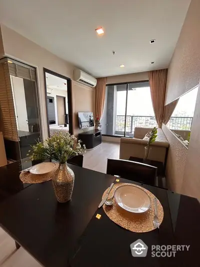 Modern living room with balcony view and elegant dining setup