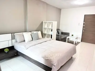 Modern bedroom with cozy bed and stylish decor in a spacious apartment