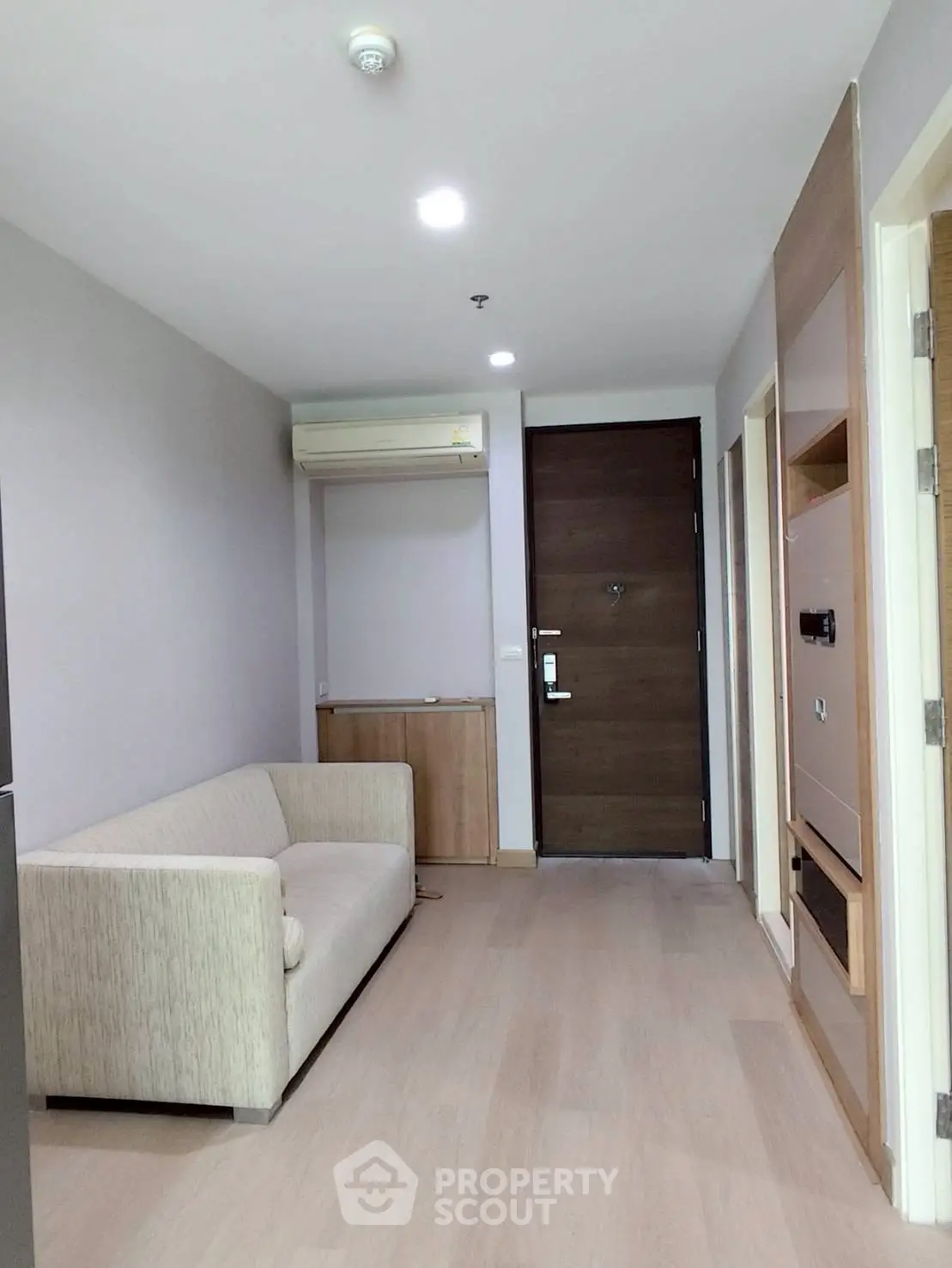 Modern apartment entrance with cozy living area and sleek design