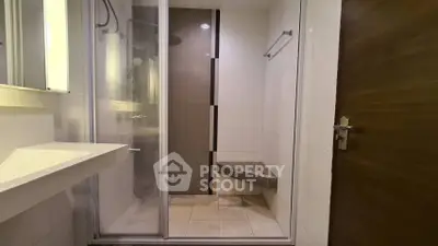 Modern bathroom with glass shower enclosure and sleek design