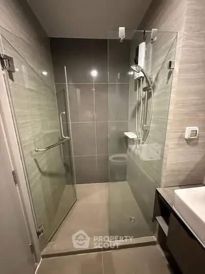 Modern bathroom with glass shower enclosure and sleek design