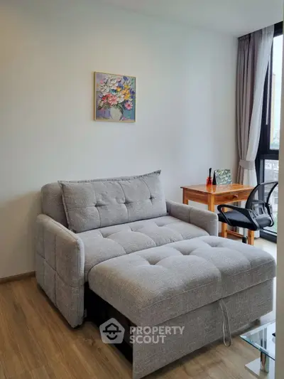 Modern living room with stylish sofa bed and large window view