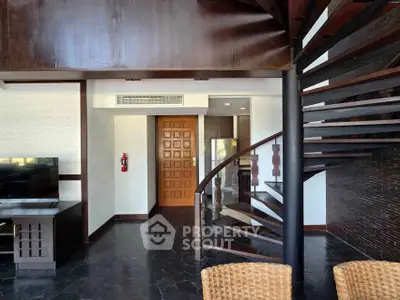 Modern duplex interior with spiral staircase and stylish decor