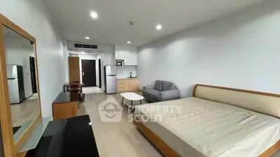 Spacious studio apartment with modern furnishings and open layout in prime location.