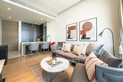 Modern living room with stylish decor and open kitchen layout