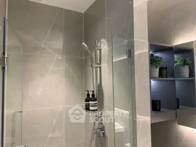 Modern bathroom with sleek shower and elegant shelving