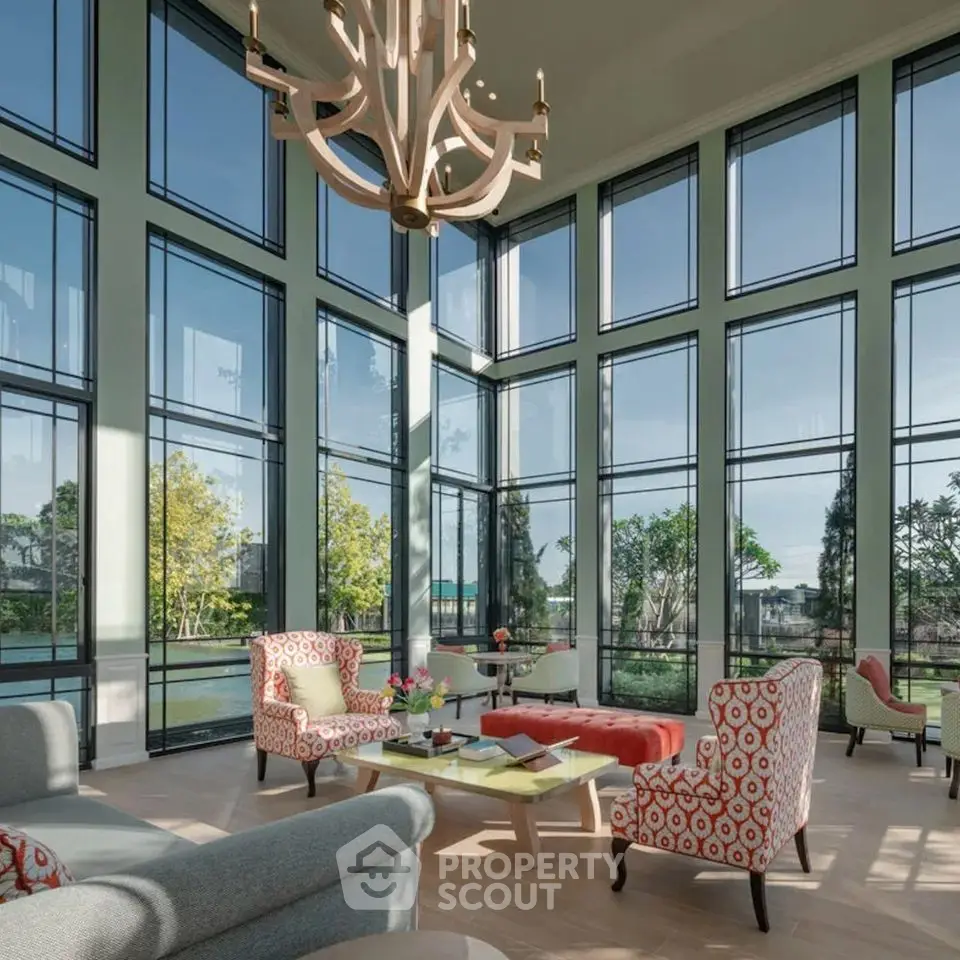 Luxurious living room with floor-to-ceiling windows and elegant decor