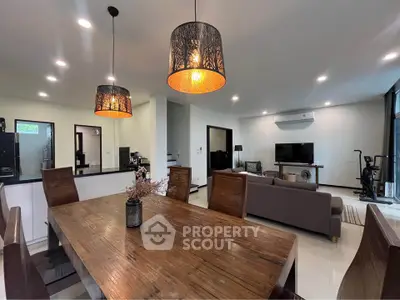 Spacious modern living room with elegant dining area and stylish lighting