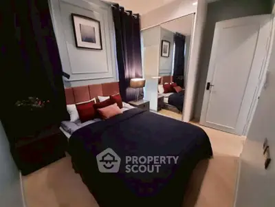 Cozy modern bedroom with stylish decor and ample natural light