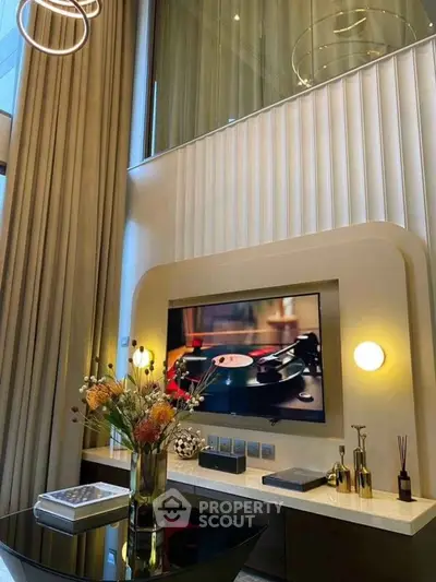 Luxurious modern living room with high ceilings and elegant decor