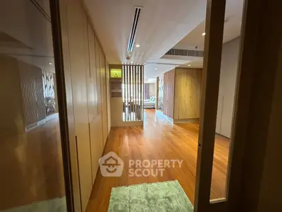 Spacious modern living room with wooden flooring and stylish decor