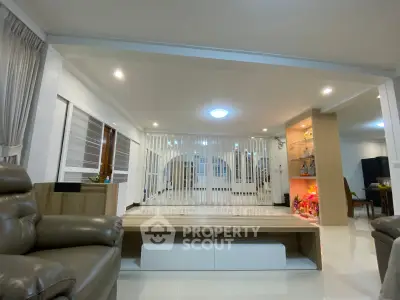 Spacious living room with modern decor and cozy seating area