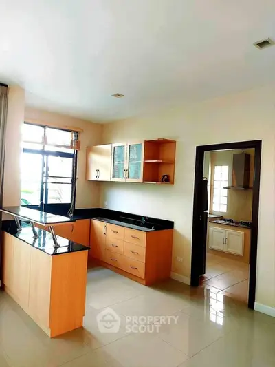 Spacious kitchen with modern cabinetry and open layout design