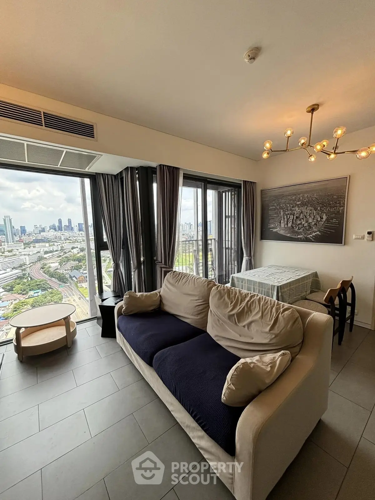 Modern living room with stunning city view and elegant decor