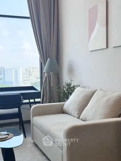 Modern living room with cozy sofa and city view, perfect for urban living.