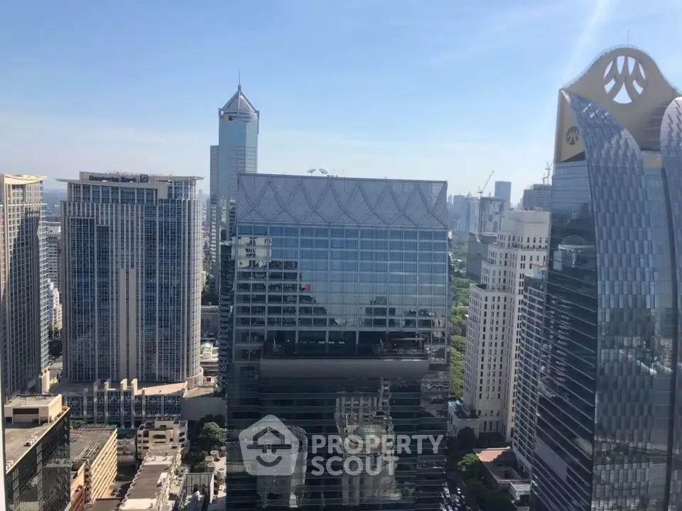 Stunning cityscape view of modern skyscrapers under a clear blue sky.