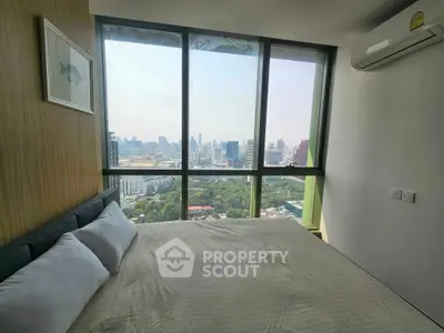 Stunning bedroom with panoramic city view and modern air conditioning.