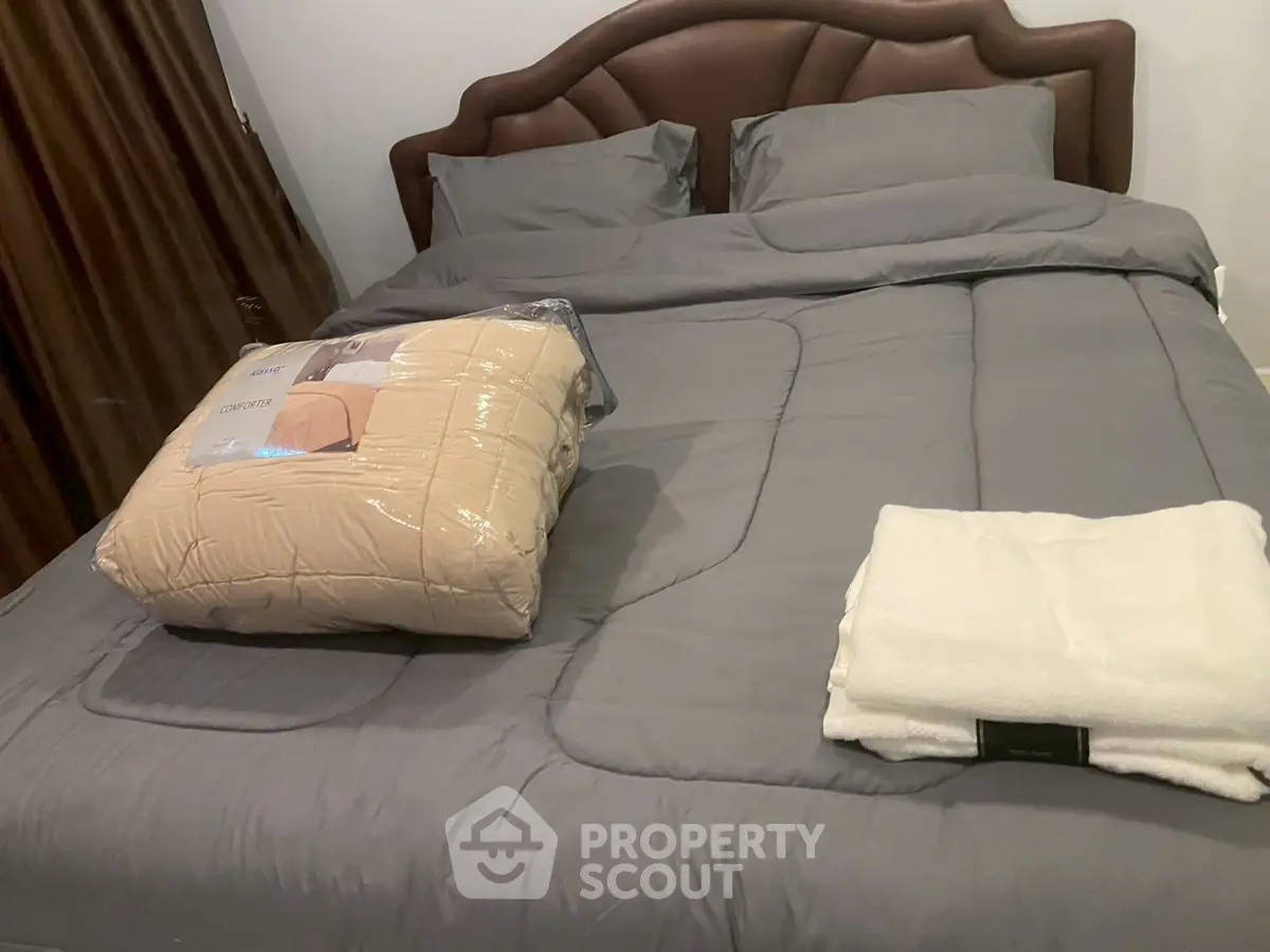 Cozy bedroom with elegant bedding and plush comforter set on a stylish bed.