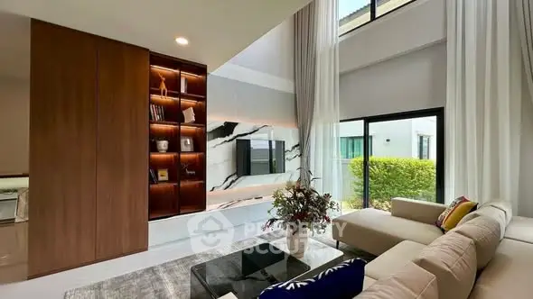 Luxurious modern living room with high ceilings and elegant decor