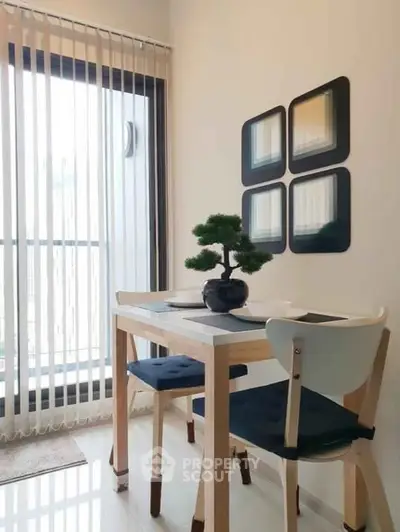 Chic dining nook with modern decor and natural light, perfect for cozy meals.