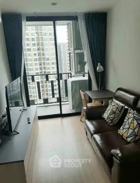 Modern living room with balcony view in high-rise apartment