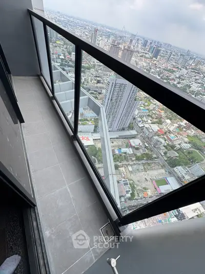 Stunning high-rise balcony with panoramic city view, perfect for urban living enthusiasts.