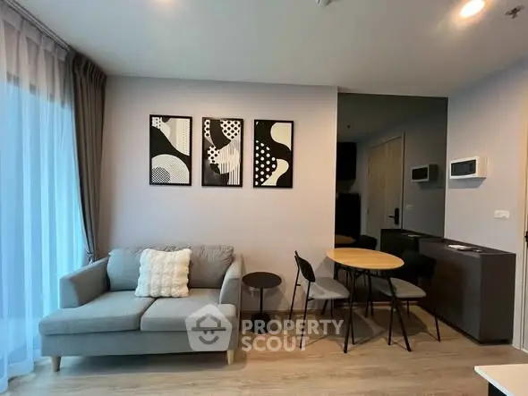 Modern living room with stylish decor and cozy seating area in a contemporary apartment.