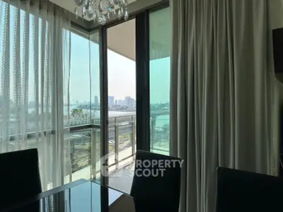 Luxurious dining area with stunning city view from large balcony windows.