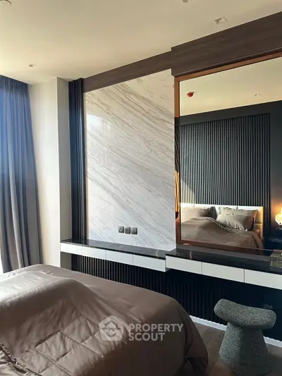 Luxurious modern bedroom with elegant marble accent wall and stylish decor