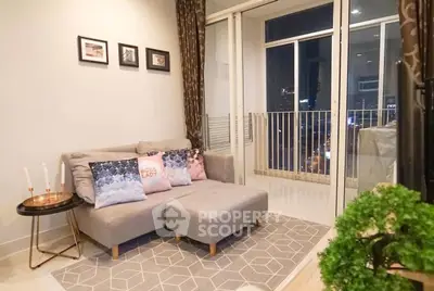 Chic living room with cozy sofa and city view balcony in modern apartment