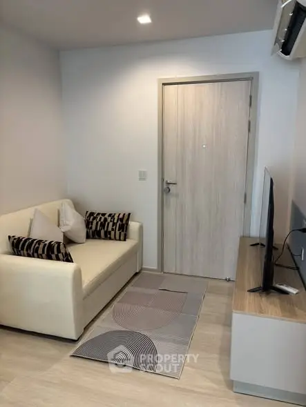 Cozy living room with modern decor and stylish furniture, perfect for relaxation and entertainment.