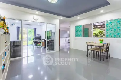 Spacious open-plan living area with modern decor and natural light