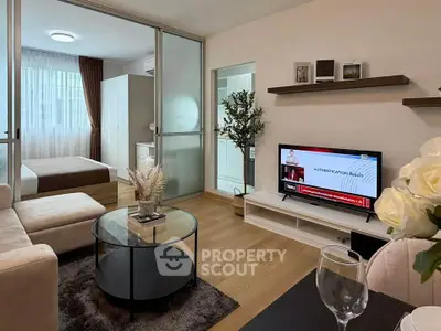 Modern living room with open layout, stylish decor, and cozy ambiance in a contemporary apartment.