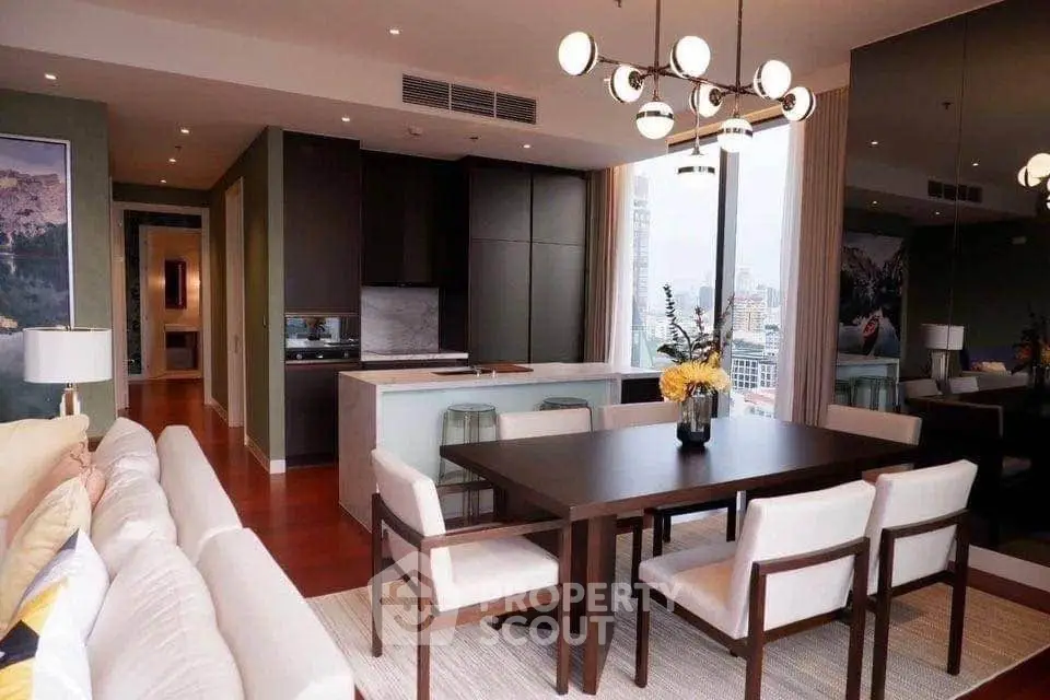 Luxurious modern living room with open kitchen and city view, featuring elegant dining area and stylish decor.
