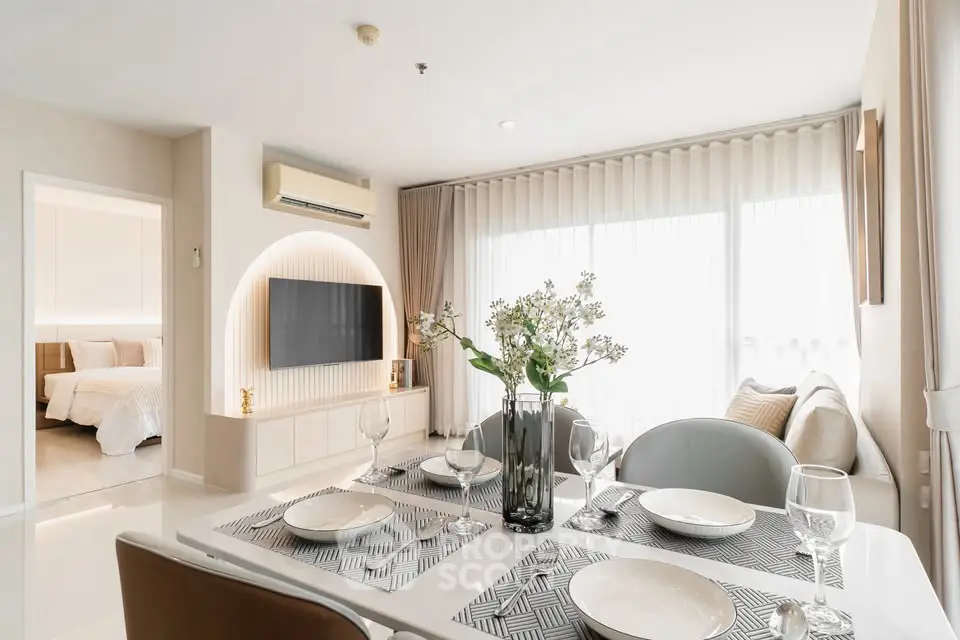 Modern living room with dining area, stylish decor, and natural light, perfect for contemporary living.