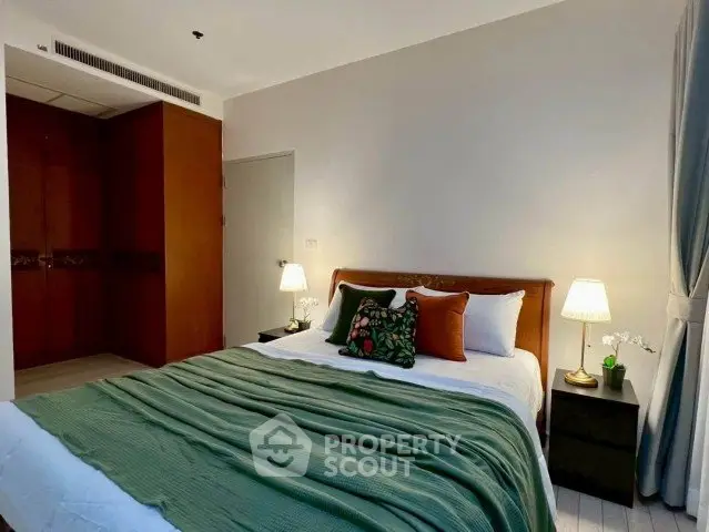 Cozy bedroom with stylish decor and ambient lighting, perfect for relaxation and comfort.