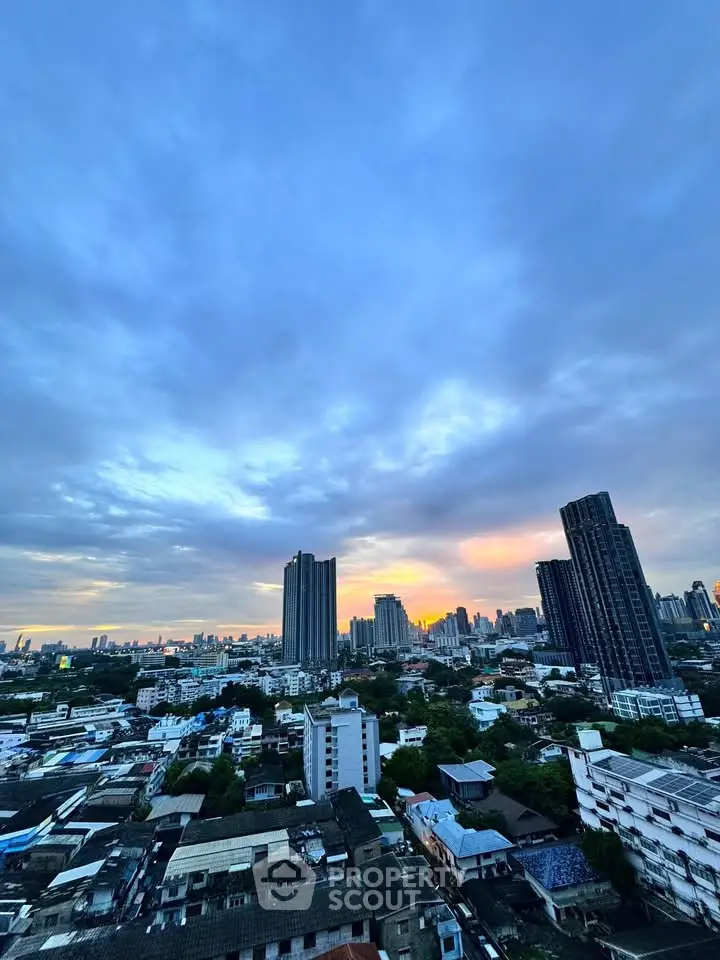 Stunning cityscape view with high-rise buildings at sunset, perfect for urban living enthusiasts.