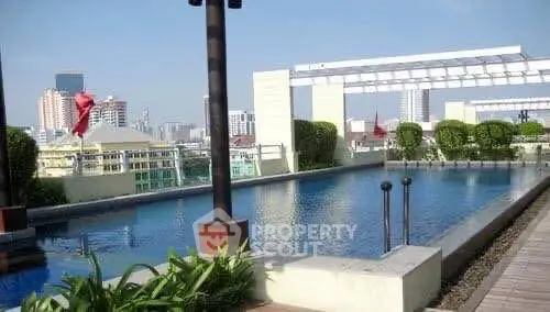 Luxurious rooftop pool with city skyline views and modern design.