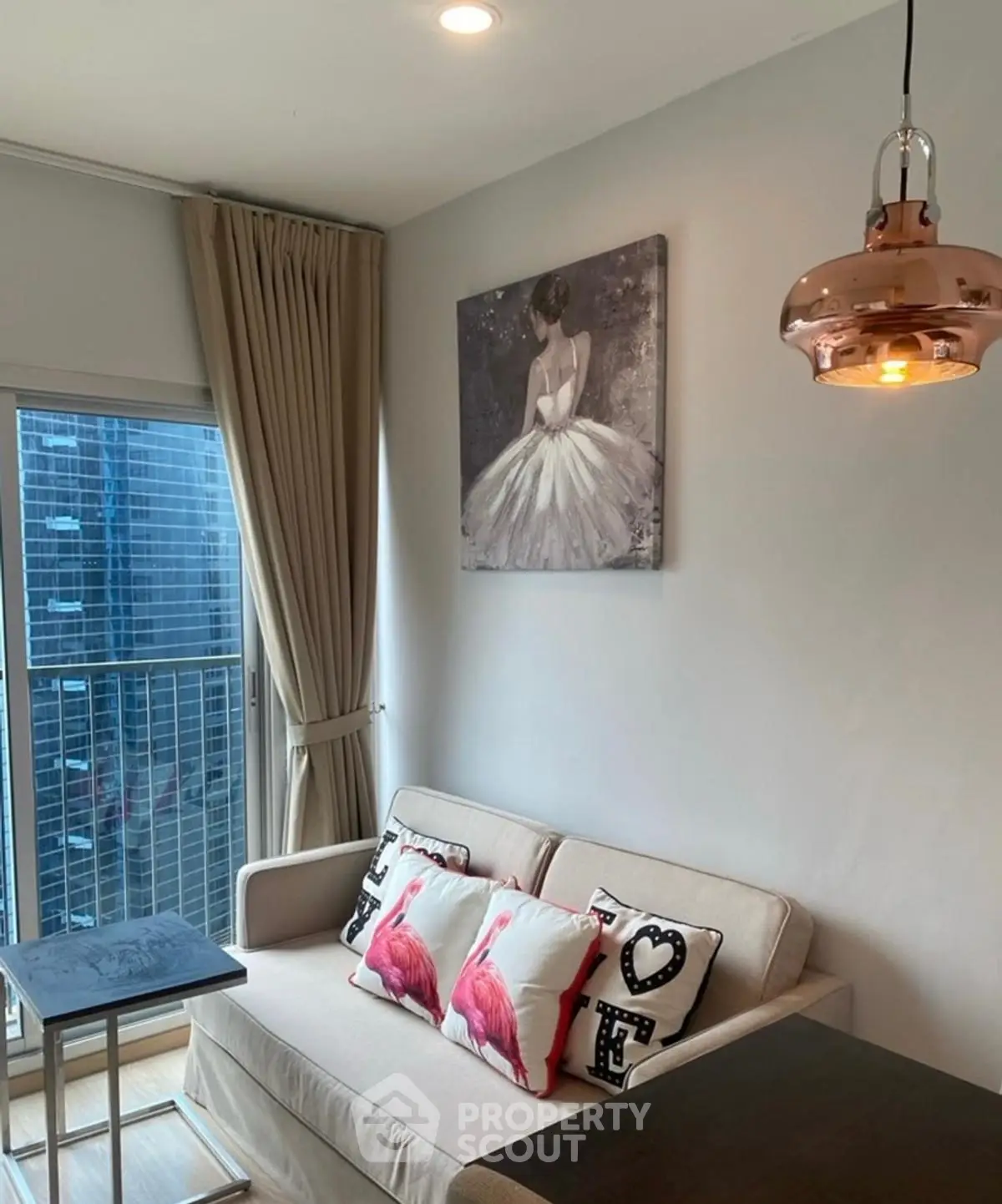 Chic modern living room with elegant decor and city view balcony.