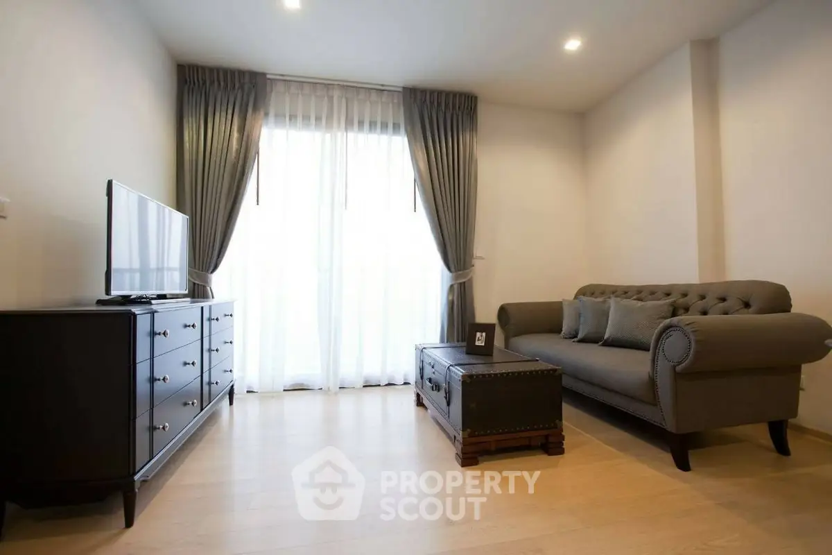 Elegant living room with modern furniture and natural light